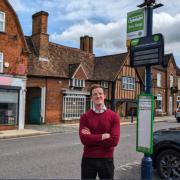 Hitchin MP Alistair Strathern at a bus stop in Shefford.