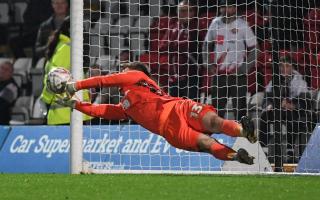 Murphy Cooper saves the final Guiseley penalty to send Stevenage through in FA Cup. Picture: TGS PHOTO