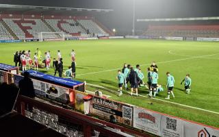 Tired bodies at half-time in extra-time between Stevenage and Cheltenham.